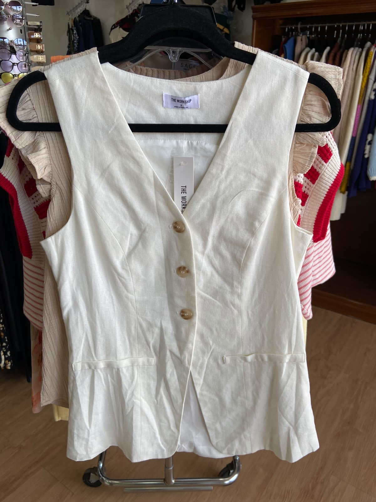 Cream Sleeveless Button-Up Blouse with Peplum Detail