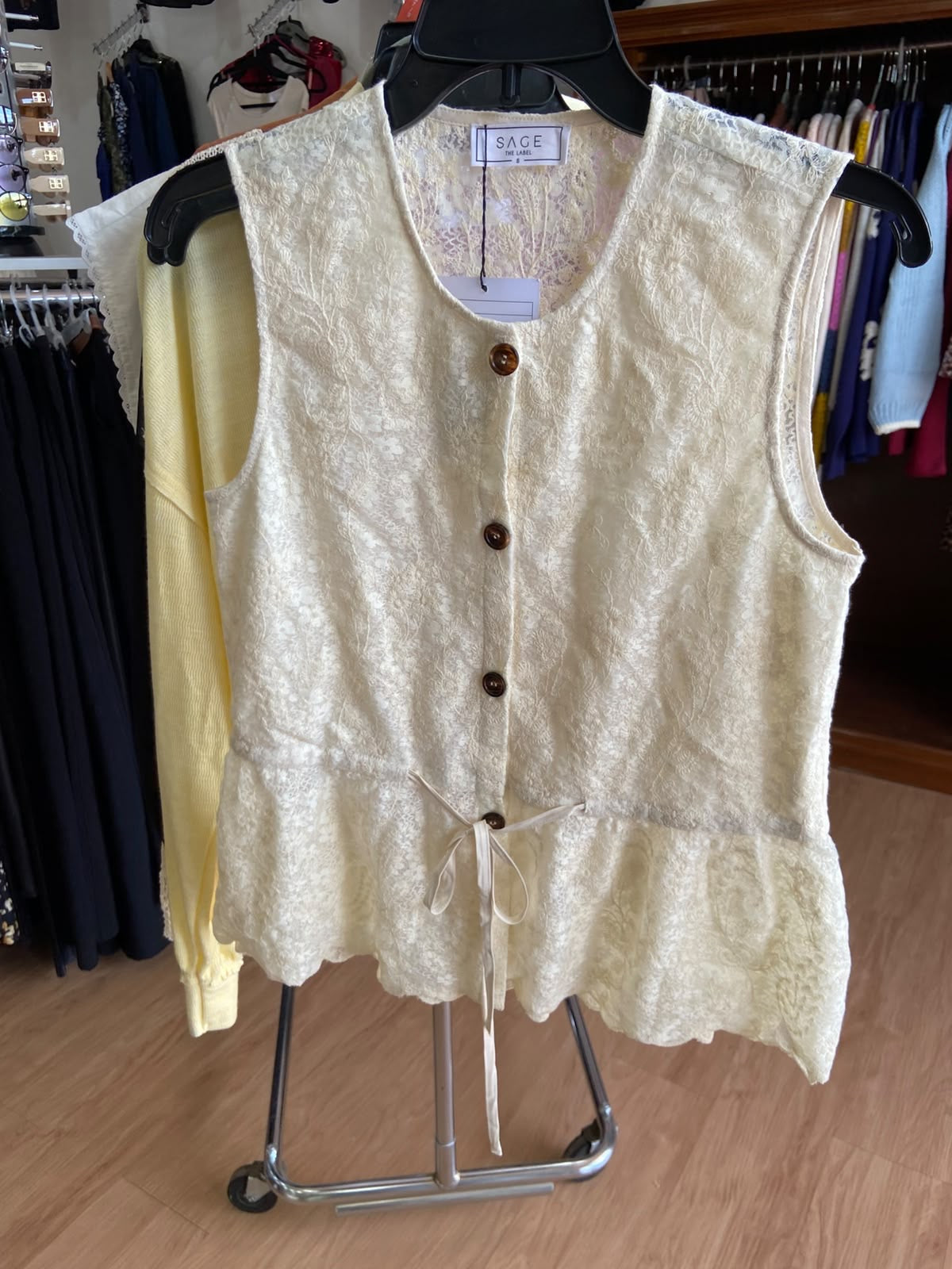 Cream Sleeveless Peplum Top with Button Detail