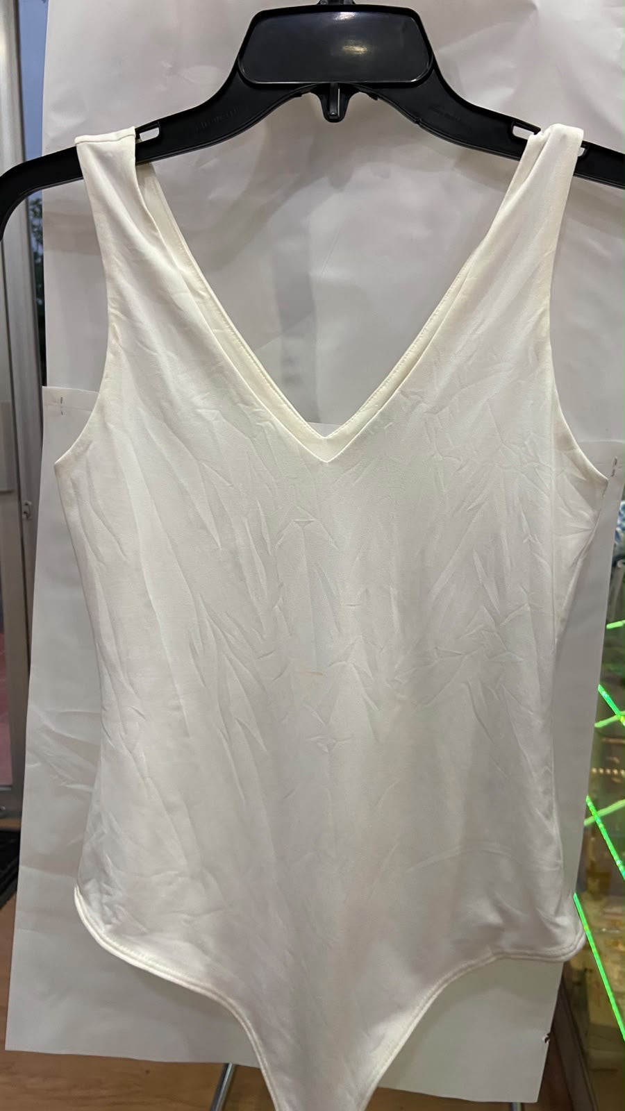 Cream Sleeveless V-Neck Bodysuit with Smooth Texture
