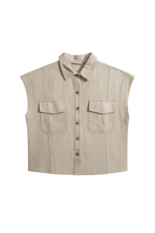 Yanet Collection Shop beige short sleeve button-up top with a classic collar and two front pockets in textured fabric.