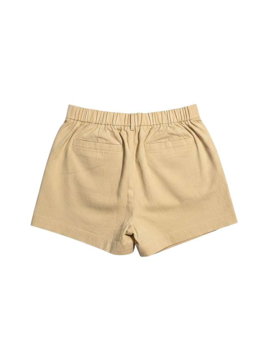 Back view of Yanet Collection Shop beige cotton shorts featuring an elastic waistband and two back pockets.