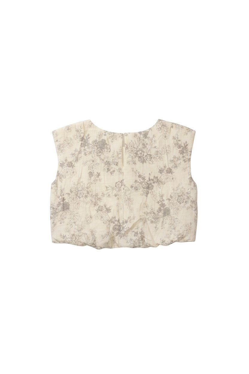 Yanet Collection Shop beige crop top with grey floral print, short sleeves, round neckline, and back zipper closure.