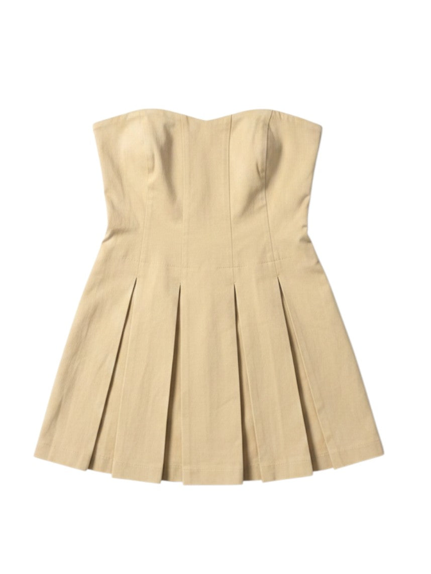 Yanet Collection Shop beige strapless mini dress with a sweetheart neckline and pleated skirt design.