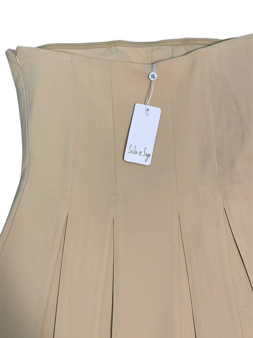 Yanet Collection Shop beige pleated skirt with a side zipper and Salis & Sage brand tag