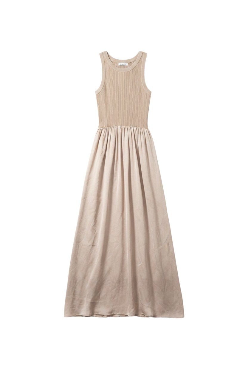 Yanet Collection Shop beige sleeveless maxi dress with a ribbed bodice and a flowy flared skirt.