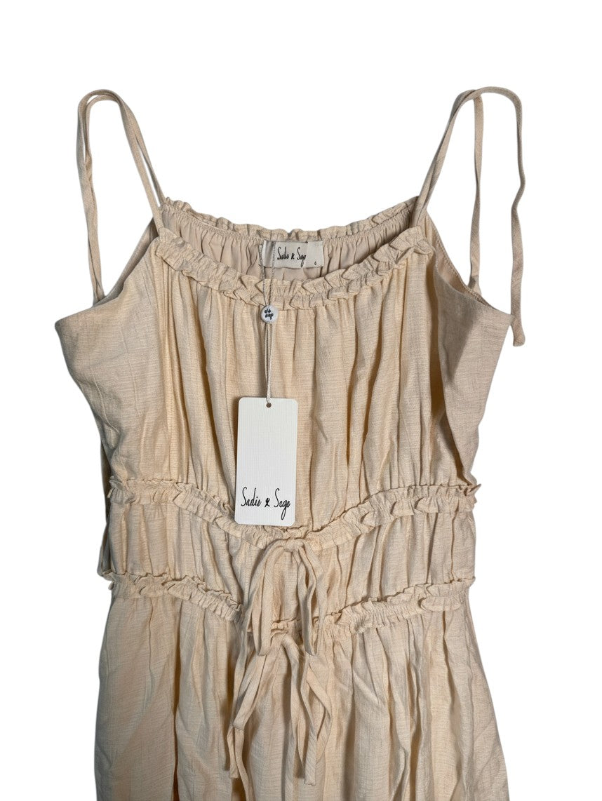 Yanet Collection Shop beige sleeveless midi dress with ruffled neckline, drawstring waist, and spaghetti straps.