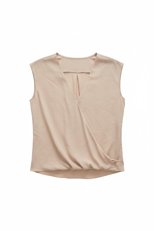 Yanet Collection Shop beige sleeveless wrap top with a flattering gathered hem and draped silhouette