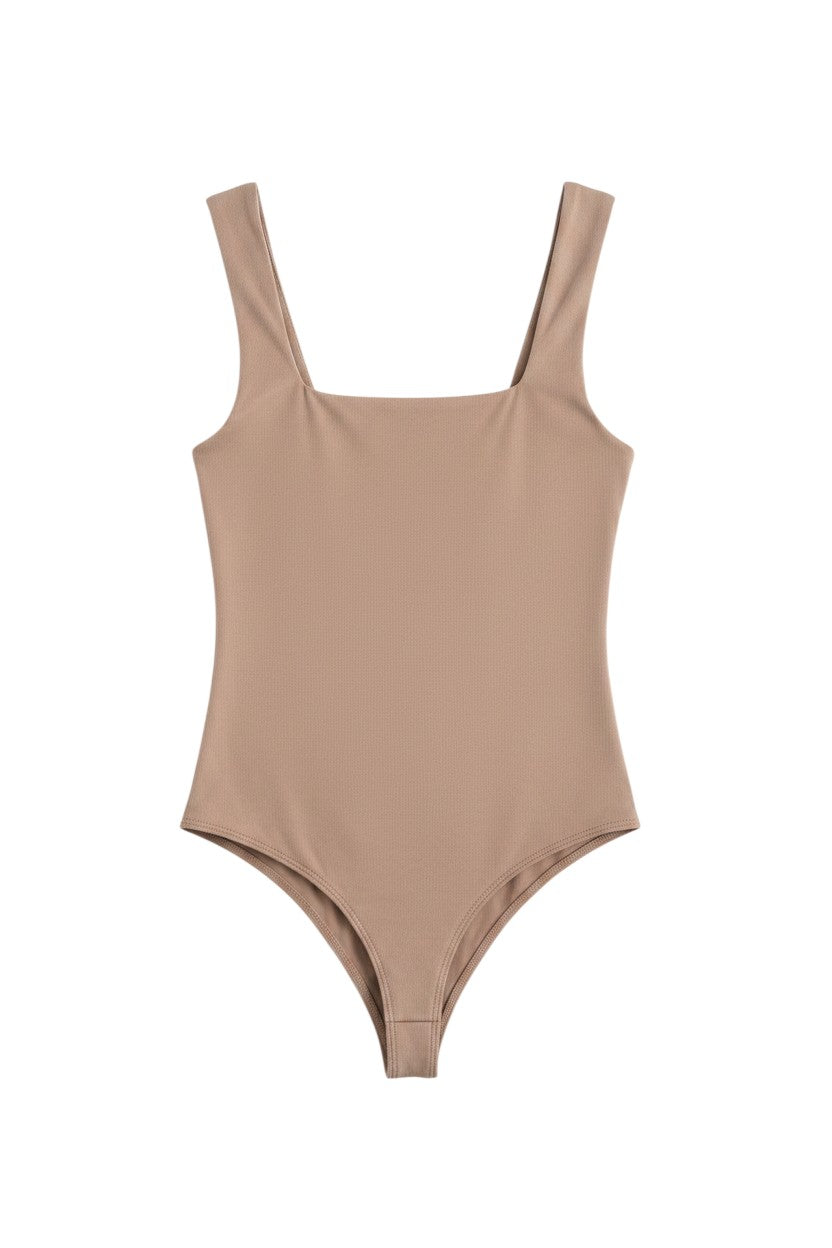 Yanet Collection Shop beige sleeveless bodysuit with a flattering square neckline and smooth stretchable fabric.