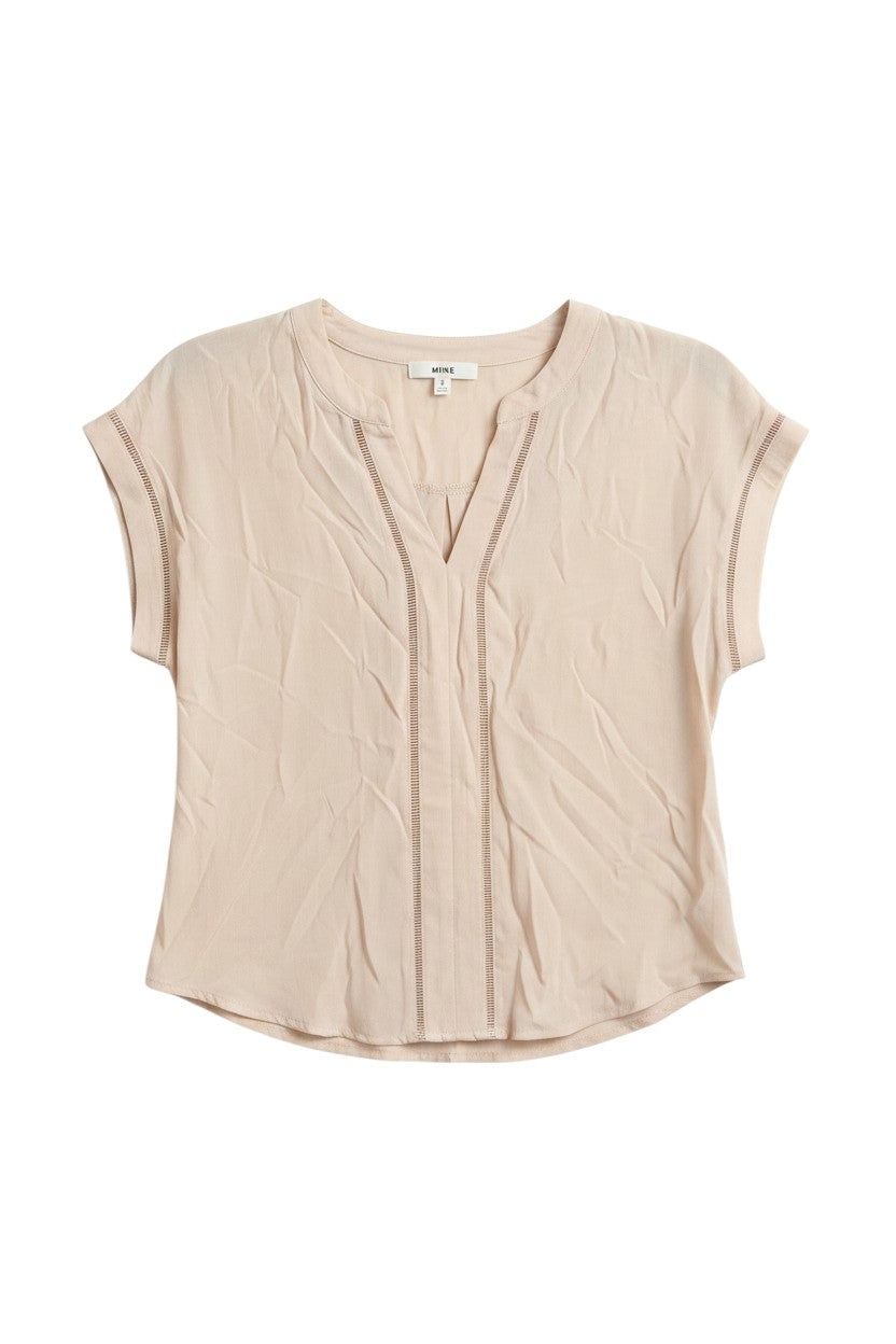 Yanet Collection Shop beige short sleeve v-neck top with delicate stitch detailing and a relaxed, crinkled texture.