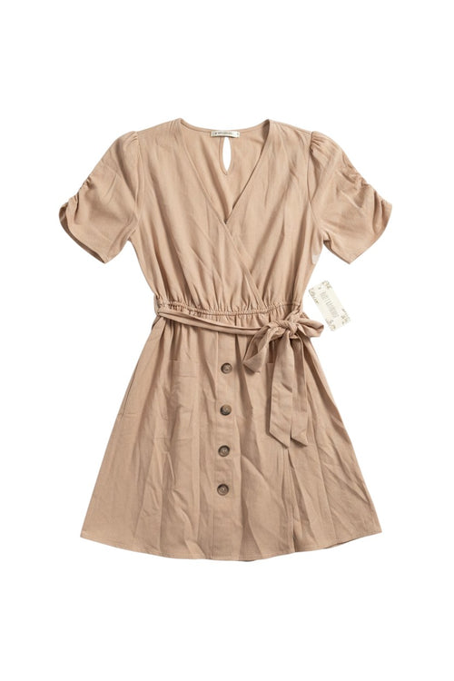 Yanet Collection Shop beige short sleeve wrap dress with a button-down front, cinched belted waist, and soft texture.