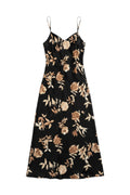 Yanet Collection Shop black maxi dress with spaghetti straps and beige floral print in a flowing silhouette