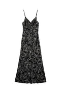 Yanet Collection Shop black maxi dress with white line-art floral print, spaghetti straps, and draped silhouette.