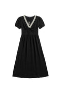 Yanet Collection Shop black maxi dress with short sleeves, white lace neckline trim, and a button-down front.