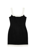 Yanet Collection Shop black sleeveless mini dress with a square neckline and white contrast hem detail.