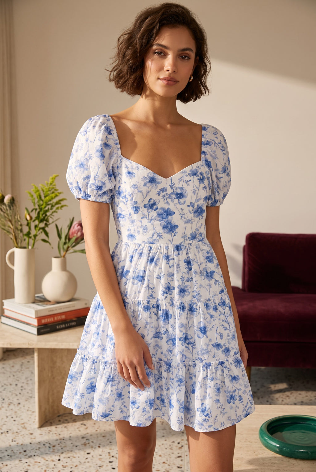 Yanet Collection Shop blue and white floral print mini dress with short puff sleeves and a sweetheart neckline.