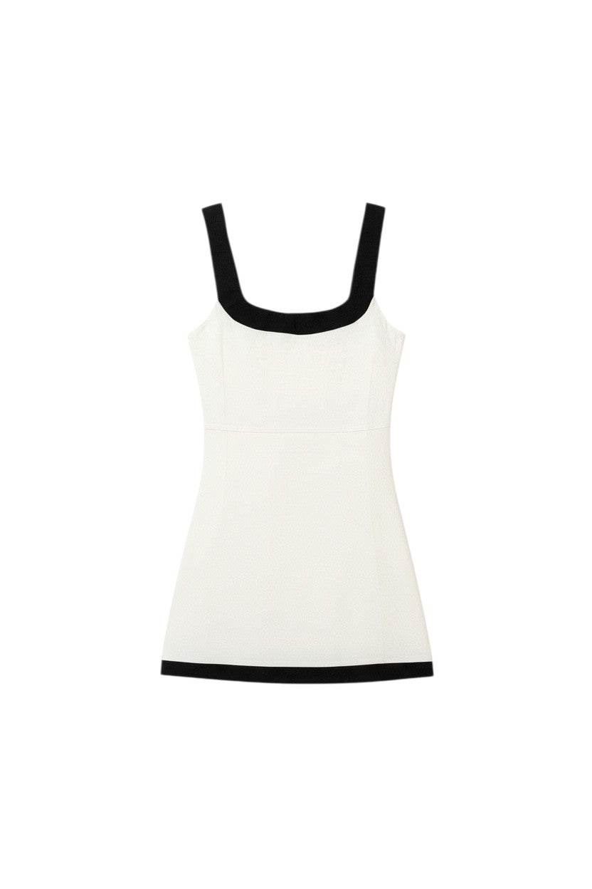 Yanet Collection Shop cream sleeveless fitted top with a square neckline and contrasting black trim details.