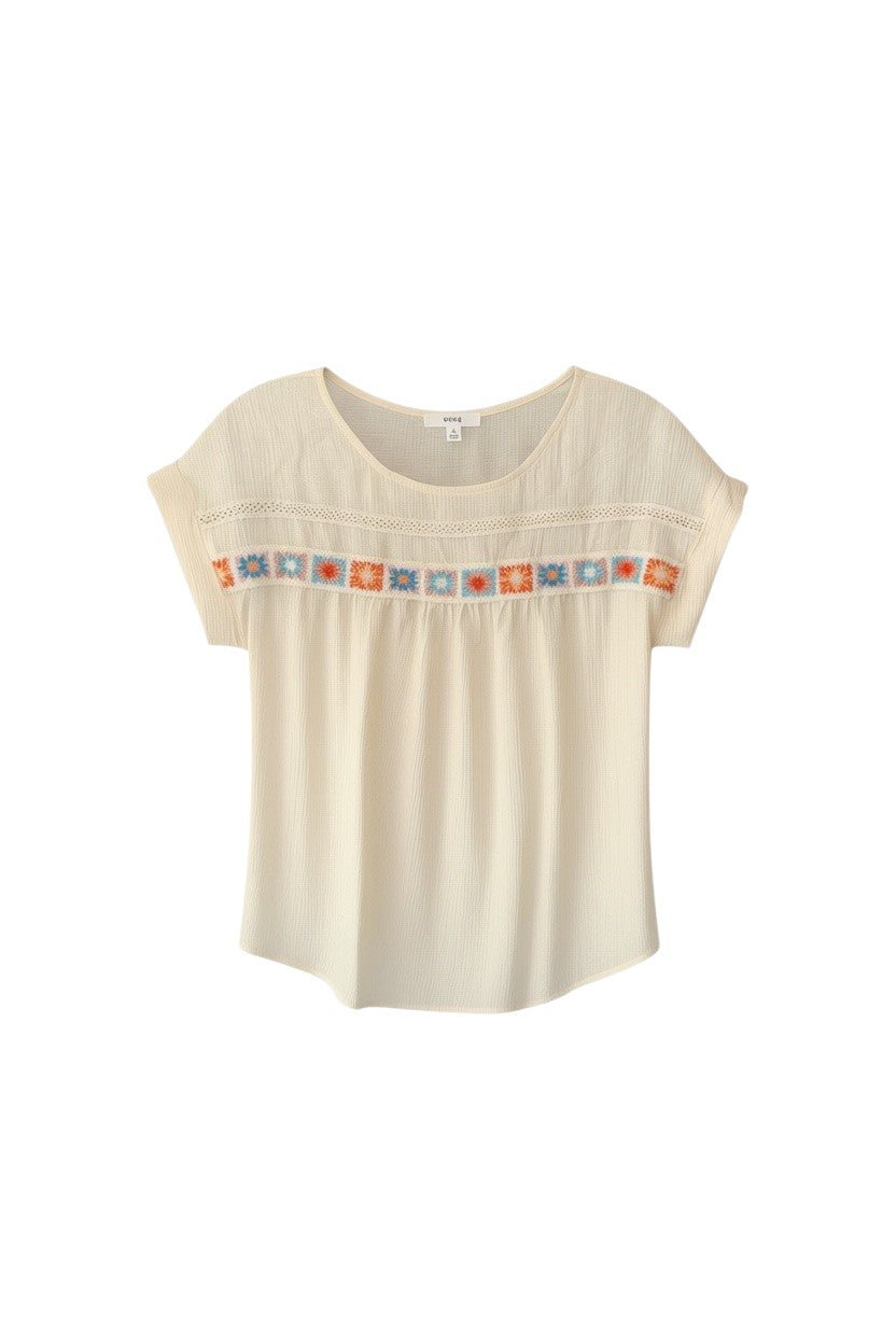 Yanet Collection Shop cream short sleeve top with colorful floral embroidery and textured fabric detail