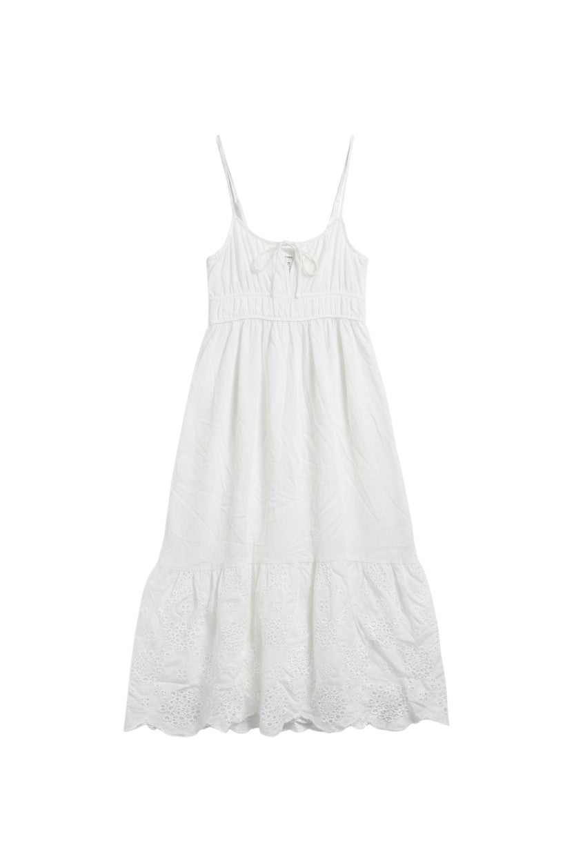 Yanet Collection Shop cream sleeveless maxi dress with delicate eyelet trim at the hem and adjustable spaghetti straps.