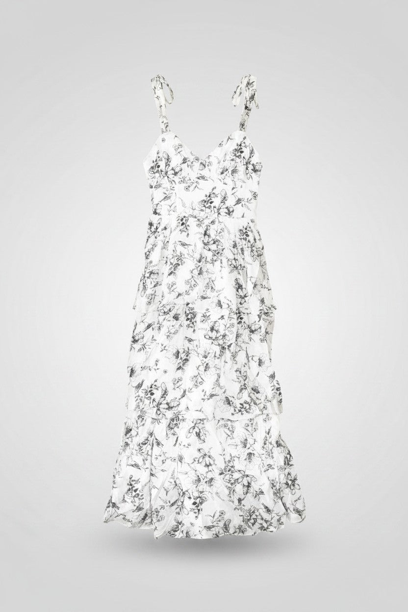 Yanet Collection Shop cream floral maxi dress with ruffled layers, sweetheart neckline, and spaghetti straps.