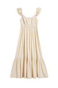 Yanet Collection Shop cream maxi dress with flutter sleeves, smocked waist, and a ruffled hem in lightweight fabric.