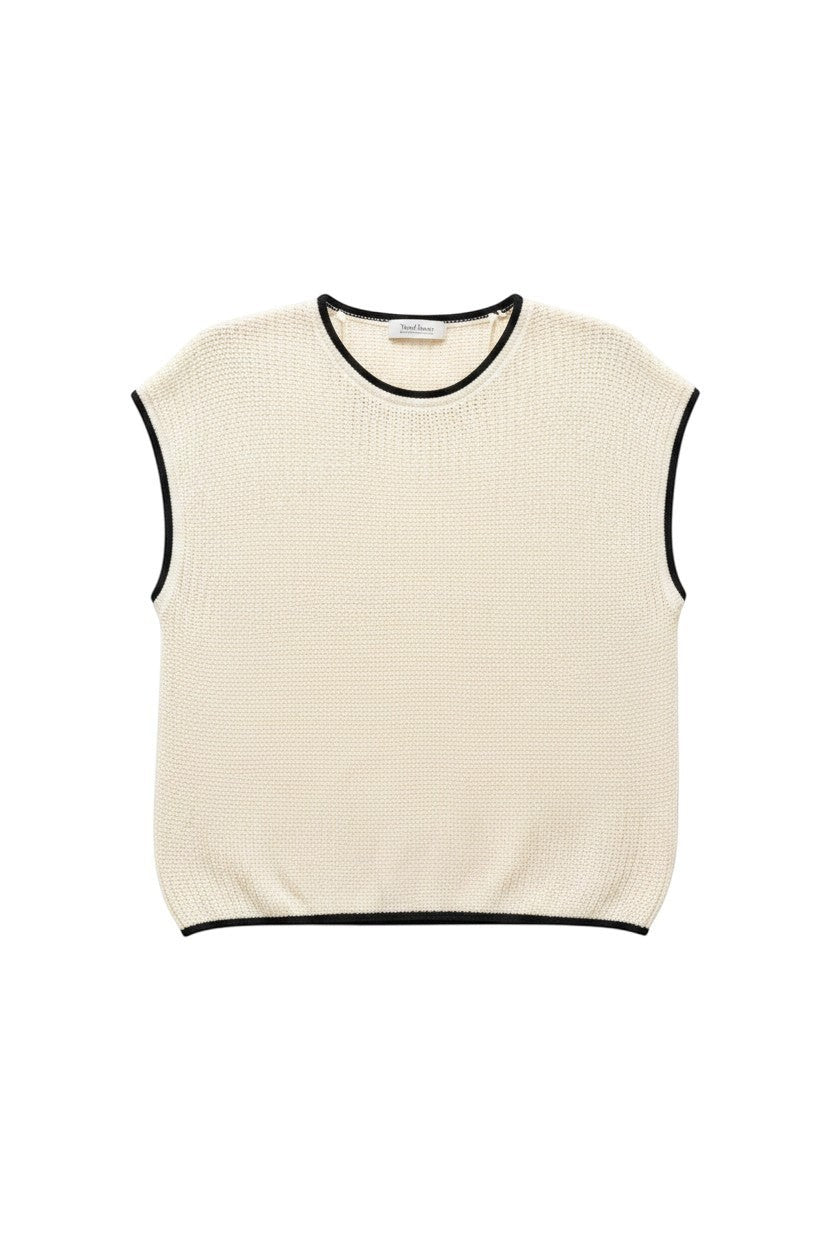 Yanet Collection Shop cream knit sleeveless top with black trim detail on the neckline, armholes, and hem.