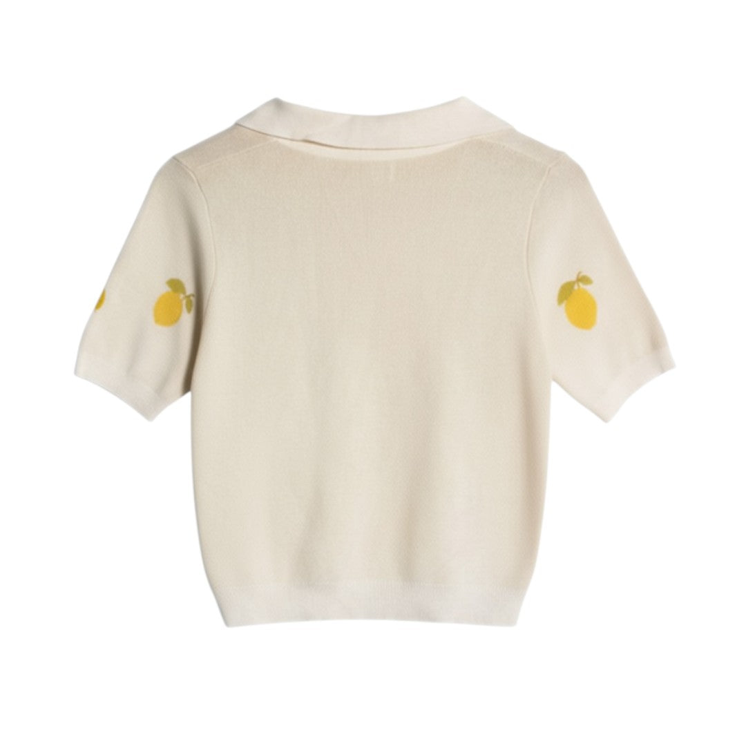 Yanet Collection Shop cream knit polo shirt with short sleeves and yellow lemon print detail on the shoulders