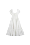 Yanet Collection Shop cream maxi dress with puff sleeves, smocked bodice, and a ruffled hem in lightweight fabric.