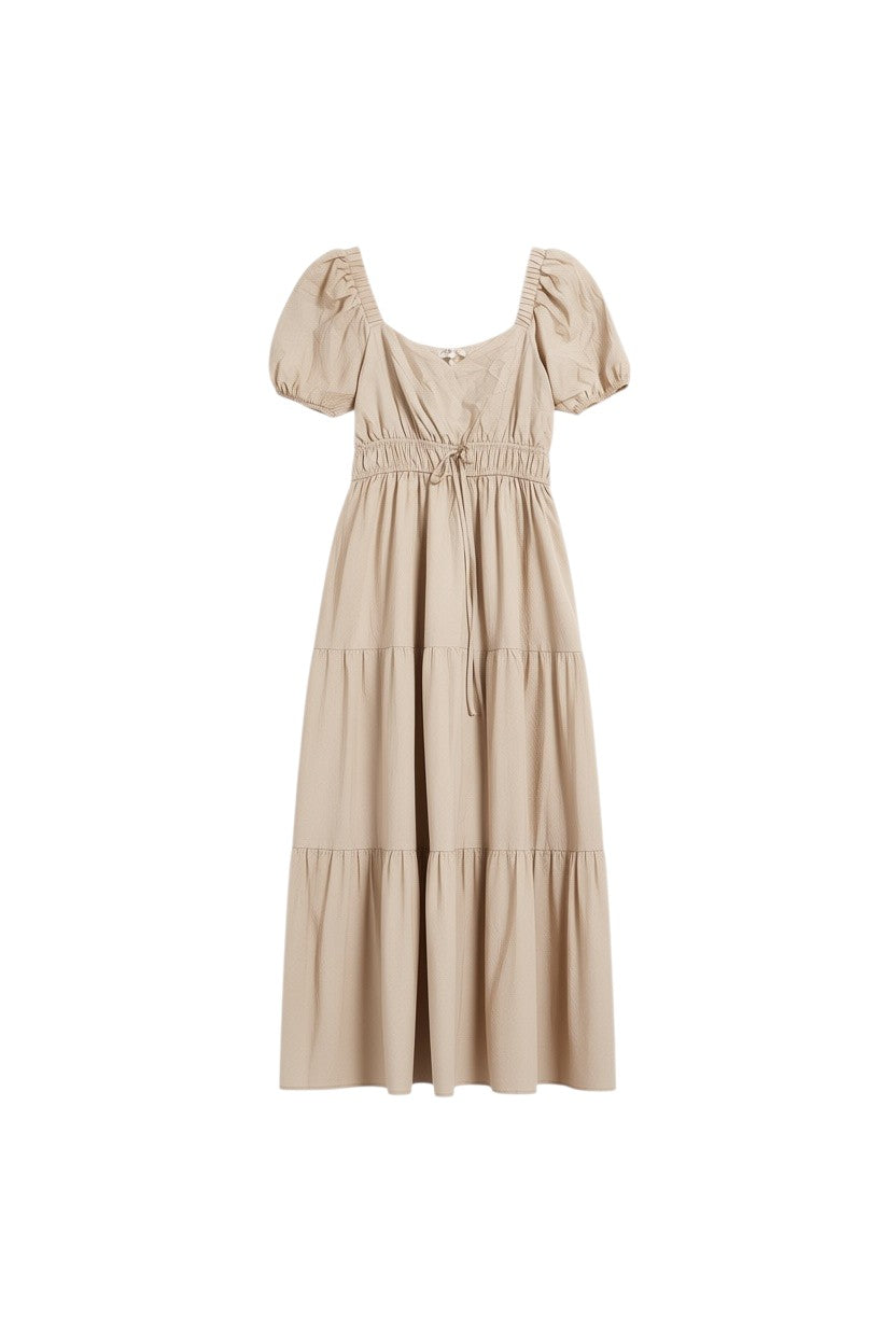 Yanet Collection Shop cream maxi dress with puff sleeves, square neckline, smocked waist, and tiered skirt.