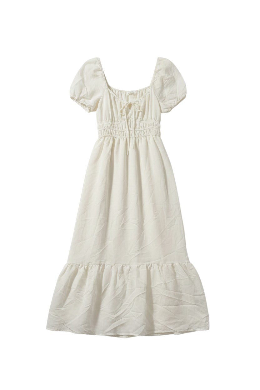Yanet Collection Shop cream maxi dress with puff sleeves, smocked bodice, and a romantic ruffled hem.