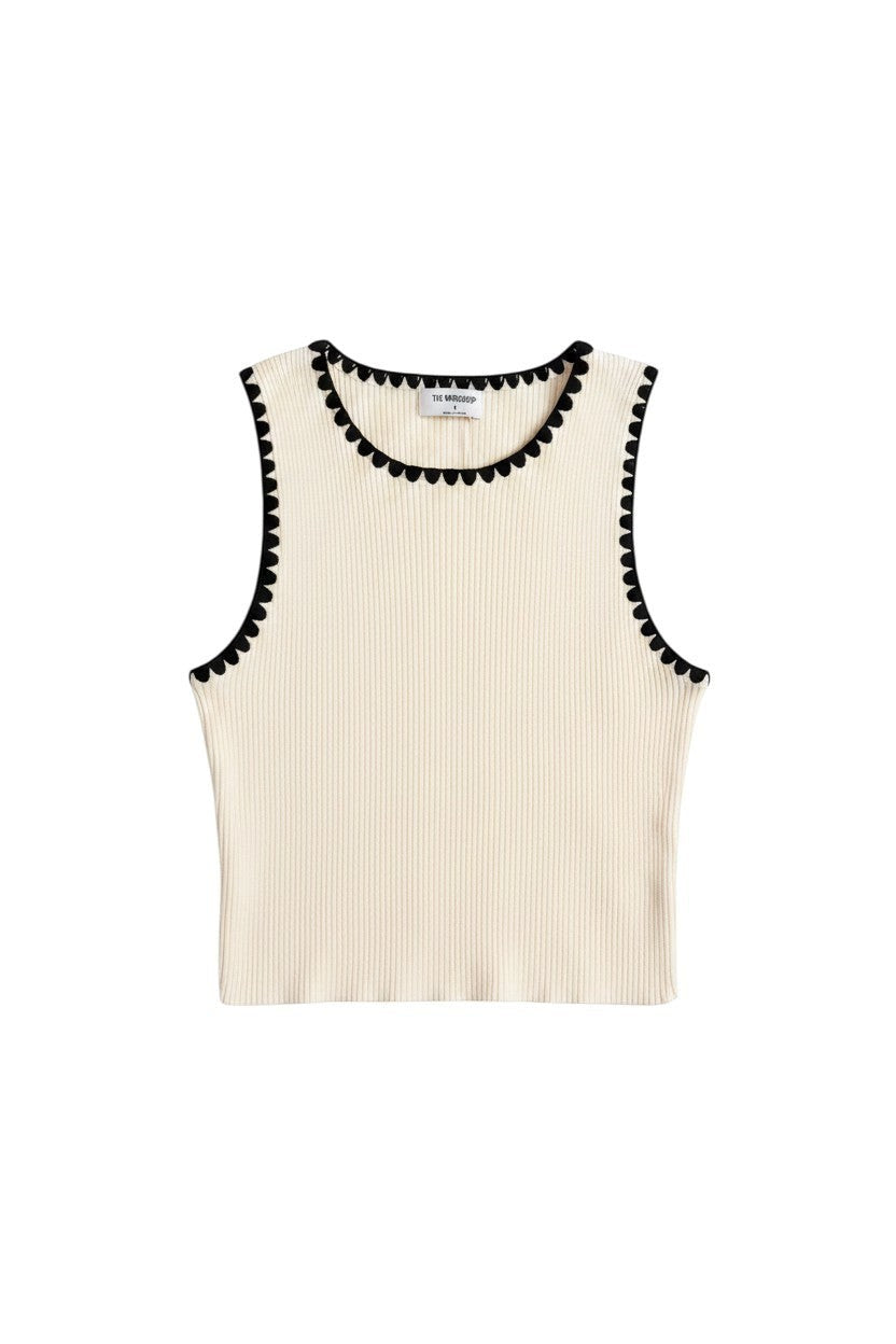 Yanet Collection Shop cream ribbed sleeveless crop top with a decorative black scalloped trim on neckline and armholes.