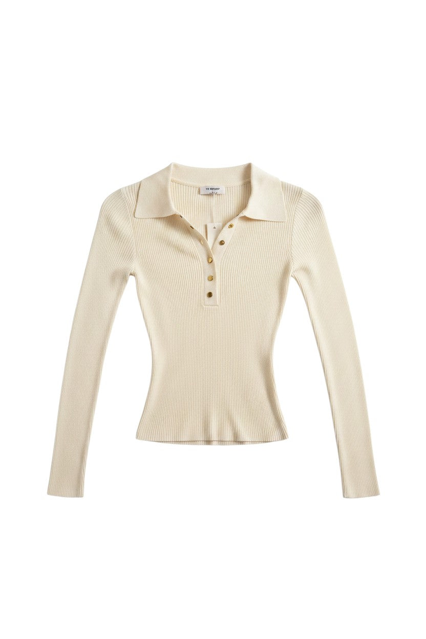 Yanet Collection Shop cream long sleeve polo top with a ribbed texture, classic collar, and gold button detail.