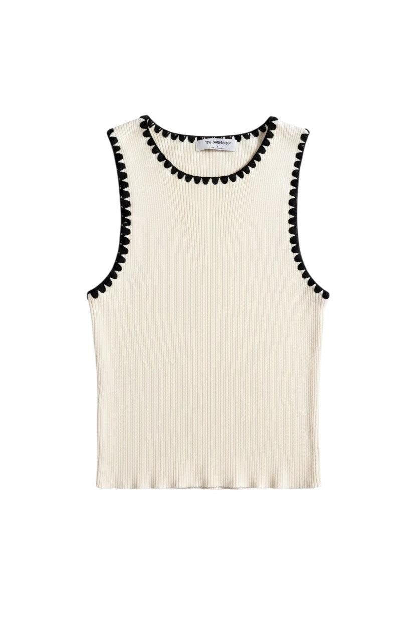 Yanet Collection Shop cream sleeveless ribbed top with a scalloped black trim along the crew neckline and armholes.
