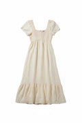 Yanet Collection Shop cream maxi dress with short flutter sleeves, smocked bodice, and a playful ruffled hem.