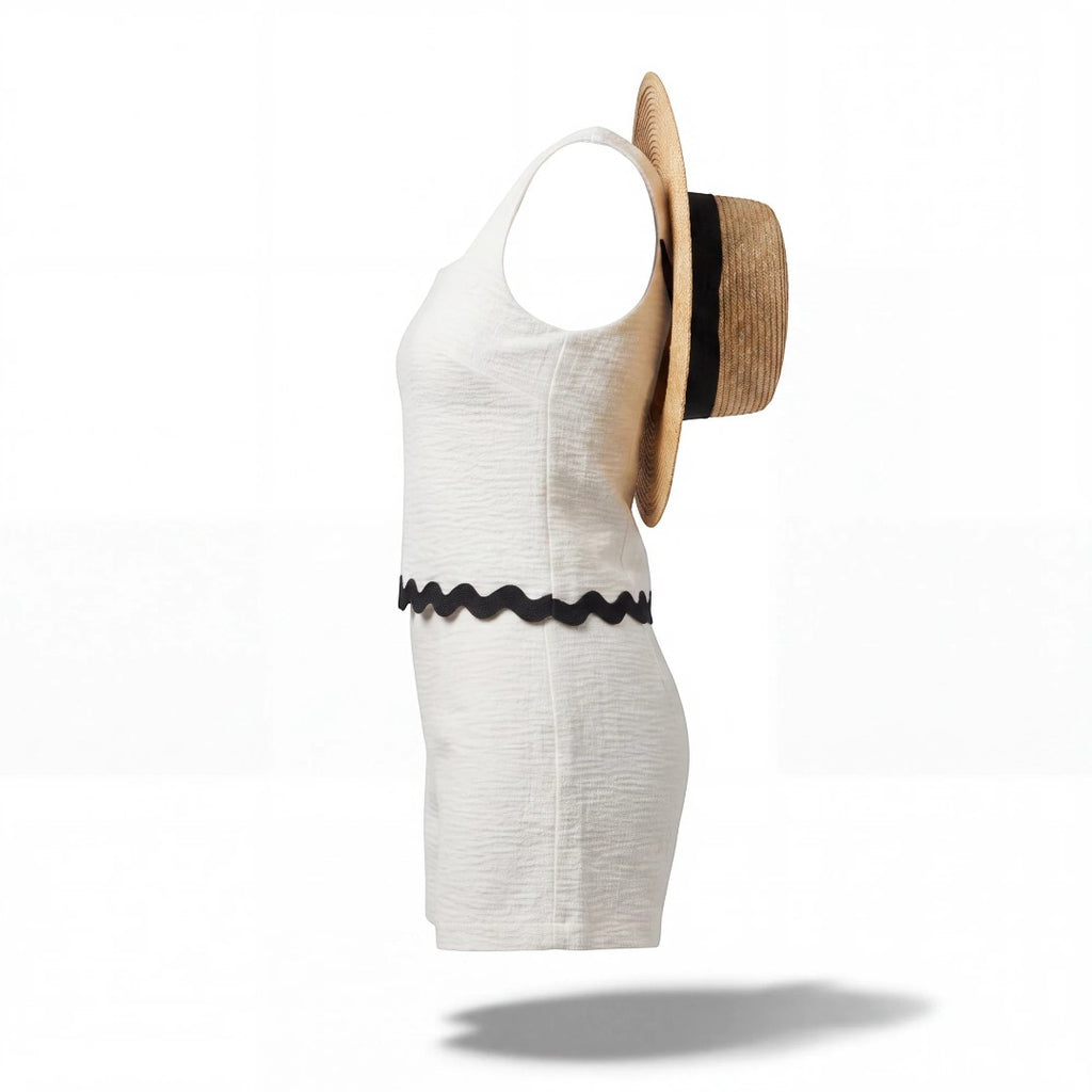 Yanet Collection Shop cream textured sleeveless crop top with a square neckline and black scalloped hem, side view.