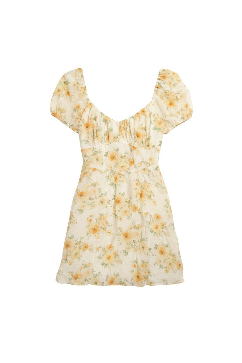Yanet Collection Shop floral mini dress with short puff sleeves, square neckline, and gathered bodice detail.