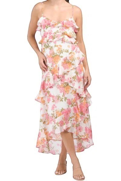Yanet Collection Shop moon river dress featuring a white floral print with pink and orange flowers and tiered ruffles