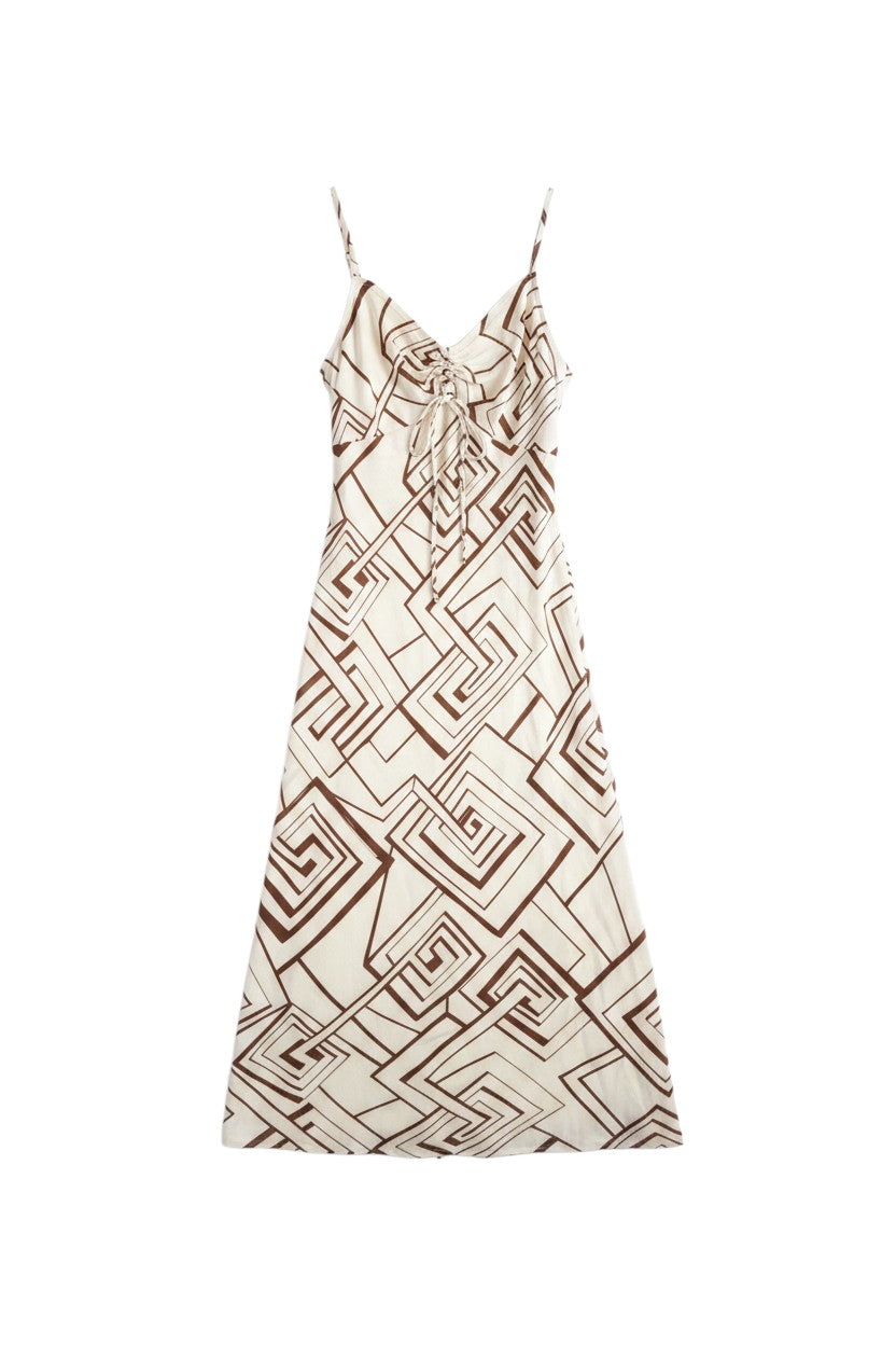 Yanet Collection Shop white maxi dress with brown geometric print, spaghetti straps, and a tie-front detail.