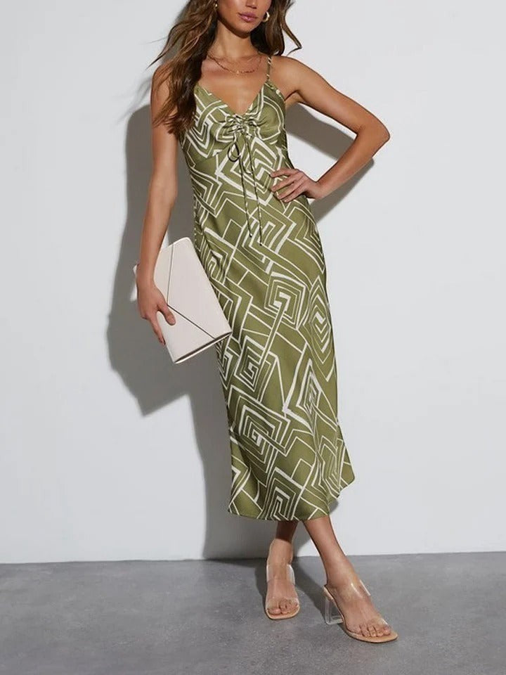 Yanet Collection Shop sage green maxi dress with white geometric print, V-neck, spaghetti straps, and drawstring front.