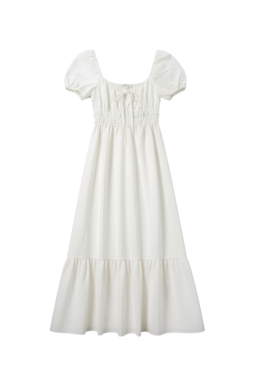 Yanet Collection Shop ivory maxi dress with puff sleeves, smocked bodice, square neckline, and ruffled hem.