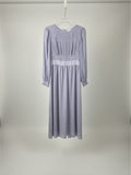 Yanet Collection Shop lavender long sleeve maxi dress with a pleated bodice and fitted waist on a hanger