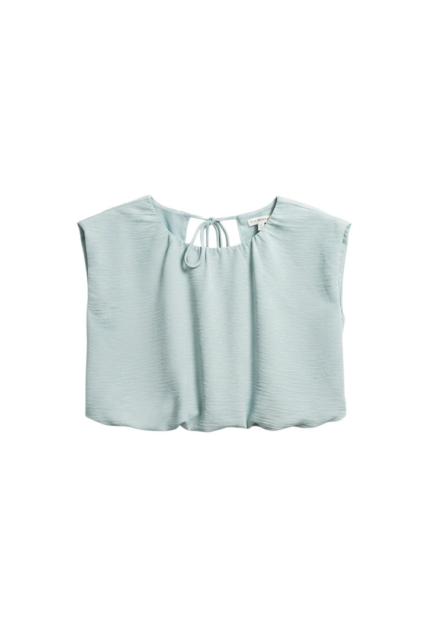 Yanet Collection Shop light blue textured short sleeve top with a delicate tie detail at the neckline.