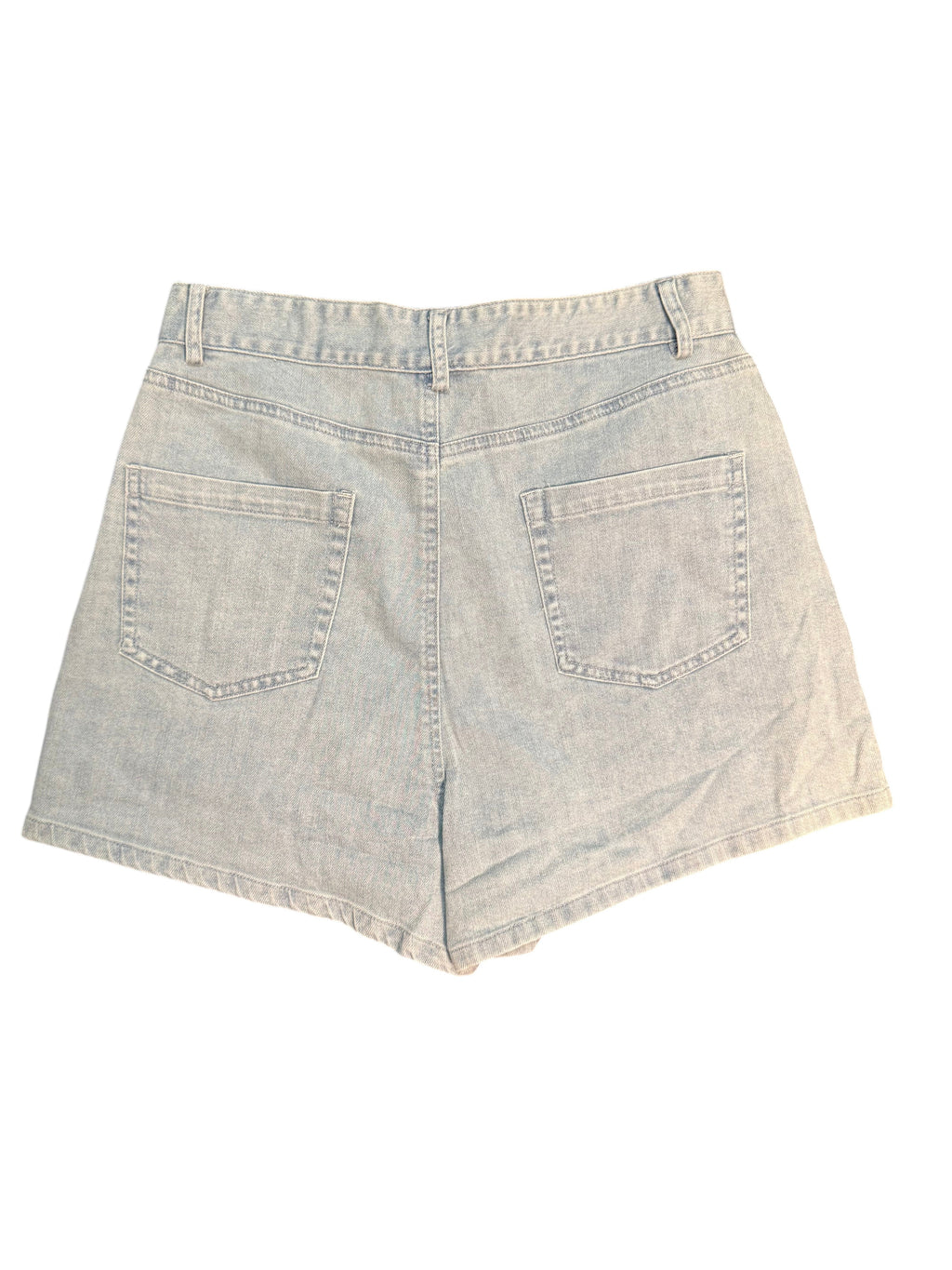 Yanet Collection Shop light wash denim shorts with a high-waisted fit and two back pockets on a dark surface.