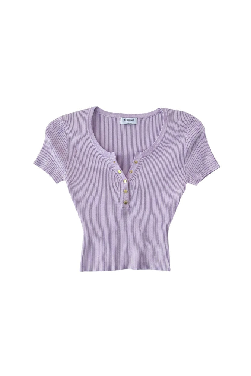 Yanet Collection Shop lilac ribbed short sleeve top with a v-neckline and gold button detail in a fitted silhouette.