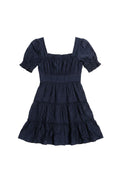 Yanet Collection Shop navy square neck dress with short puff sleeves, textured fabric, and tiered ruffled skirt.