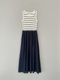 Yanet Collection Shop navy and white striped sleeveless maxi dress with a fitted bodice and flared skirt.
