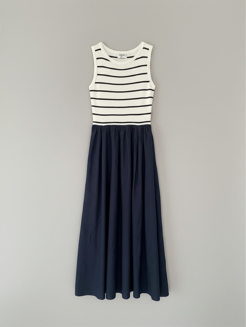 Yanet Collection Shop navy and white striped sleeveless maxi dress with a fitted bodice and flared skirt.