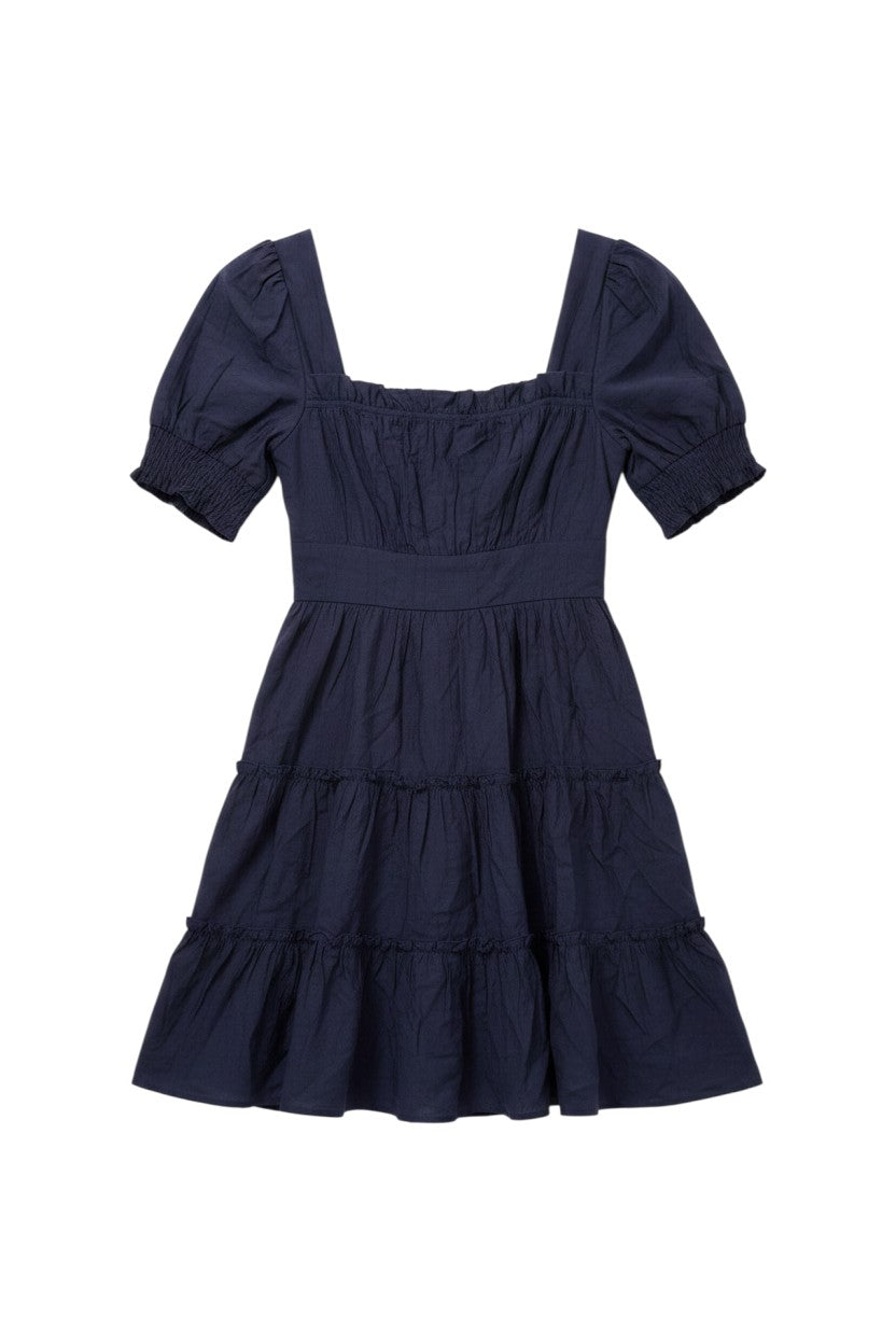 Yanet Collection Shop navy mini dress with puff sleeves, square neckline, and tiered ruffle hem in soft fabric.