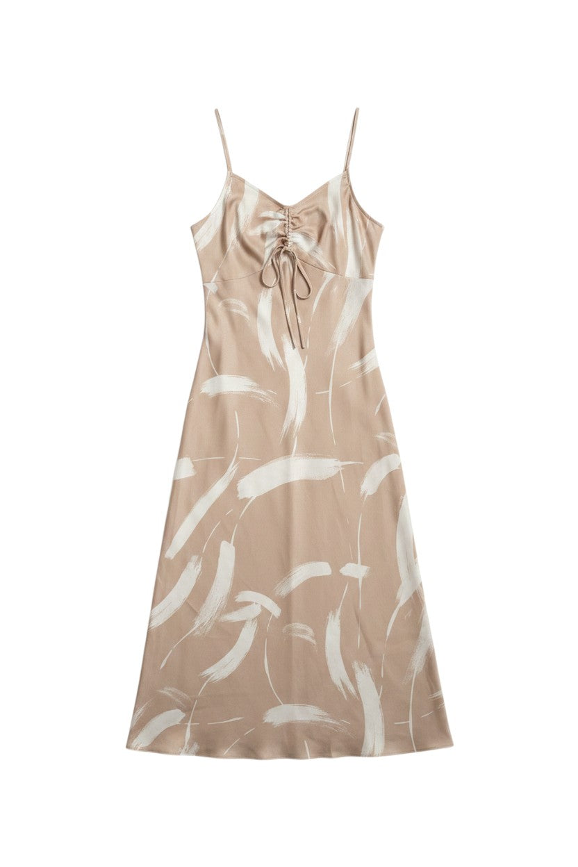 Yanet Collection Shop peach maxi dress with spaghetti straps, tie front detail, and white brushstroke pattern.