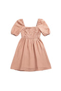 Yanet Collection Shop peach mini dress with short puff sleeves and a textured ruffled bodice in lightweight fabric.