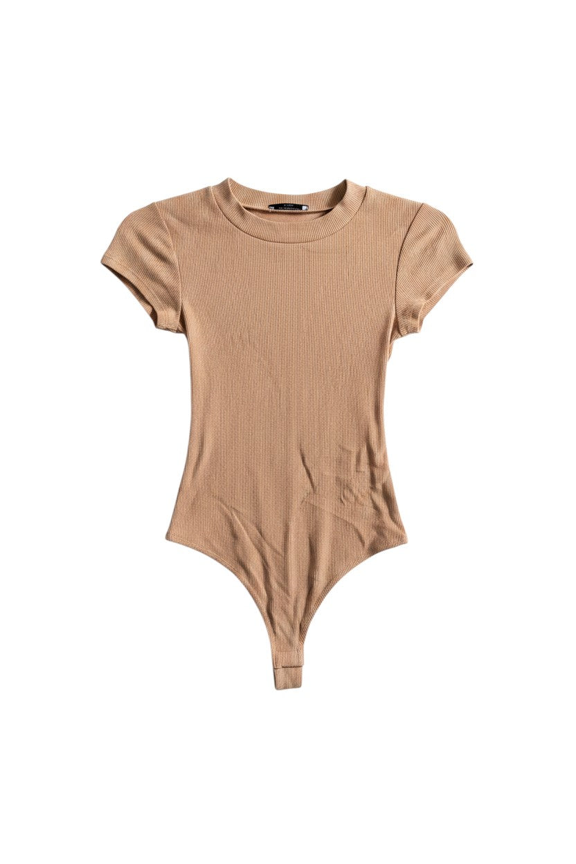 Yanet Collection Shop peach short sleeve bodysuit with a fitted silhouette and soft ribbed texture